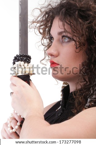Girl - woman dark curly hair natural brown-haired holding hands katana sword