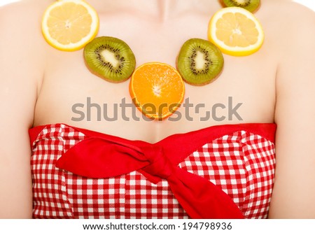 Diet. Happy girl with necklace of fresh citrus fruits isolated on white. Young woman recommending healthy food and nutrition.