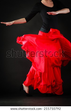 Art. Red skirt of spanish girl woman performer dancer dancing flamenco traditional dance.