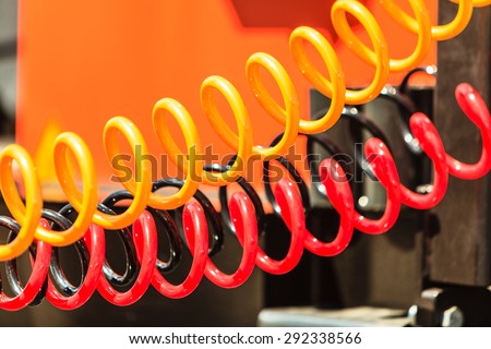 Closeup red yellow air connections hoses of machinery industrial detail