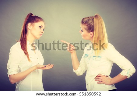 Interpersonal conflict, bad relationships, friendship difficulties concept. Quarrel between two young women friends.