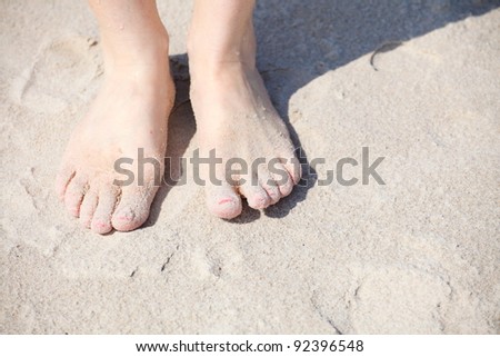 nice legs pedicure red nail sand beach