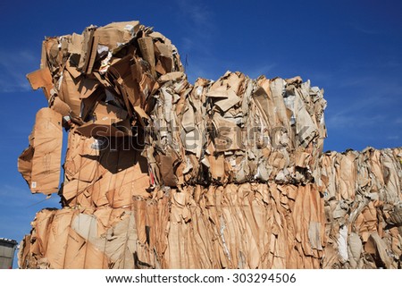 Stack of pressed paper at a recycling center
