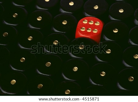 a red dice showing six and a lot of black dices showing one