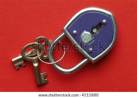 a blue padlock with keys on red