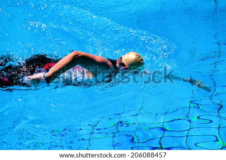 Swimming man in the pool during a triathlon in Germany