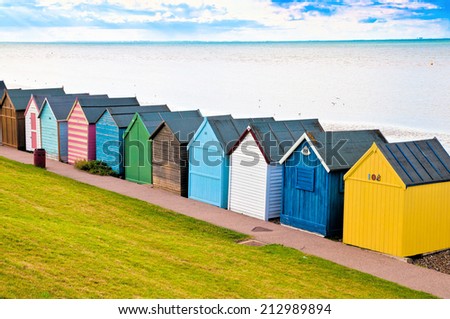 Colorful diagonal line of beach huts in England