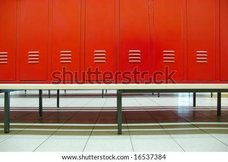 Red doors and bench in a locker room