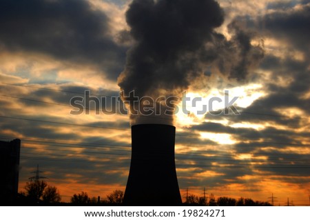 Cooling tower with water stream during sundown