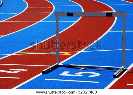 Athletic track with numbers and hurdle