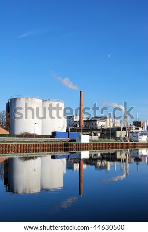 Chemical plant with reflection on a river