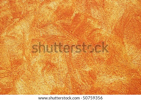 Wipe technique - Orange color on a wall of a house