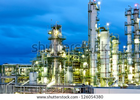 tower in petrochemical plant at night time