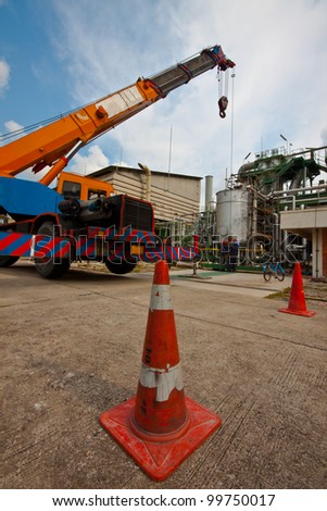 crane standing on a construction site under construction petrochemical plants