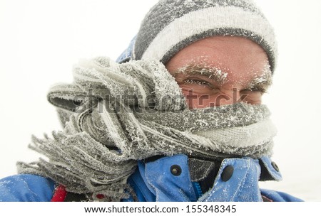 young man in winter storm with frozen eyebrows