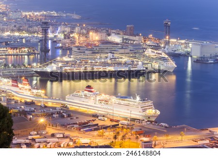 BARCELONA, SPAIN - SEPTEMBER 28, 2011: Large cruise ships in the Port of Barcelona. Night view from Montjuic hill in Barcelona, Spain.