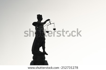 FRANKFURT AM MAIN, GERMANY - FEBRUARY 6, 2015: high contrast photo of statue of Lady Justice, known as the Roman goddess of Justice. Photo taken on February 6, 2015 in Frankfurt am Main city, Germany.