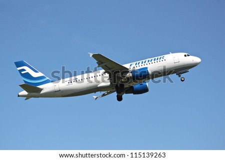 BRUSSELS - MAY 25: Airbus A320-200 of Finnair approaching Brussels Airport in Brussels, BELGIUM on May 25, 2012. Finnair is the flag carrier and largest airline of Finland.