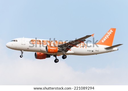 BRUSSELS - SEPTEMBER 30: Airbus A320-214 of EasyJet approaching Brussels Airport in Brussels, BELGIUM on SEPTEMBER 30, 2014. EasyJet is a British airline carrier and is the largest airline of the UK.