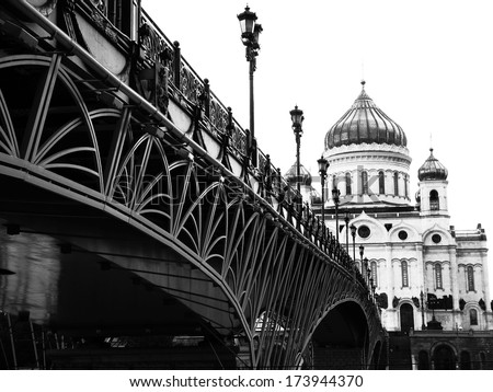 Black and white photography, monochrome,. Cityscape. Russian traditional architecture. The Cathedral and the bridge over the river. Christianity, Orthodox culture