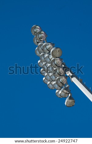 An array of lamps on a stadium lighting support