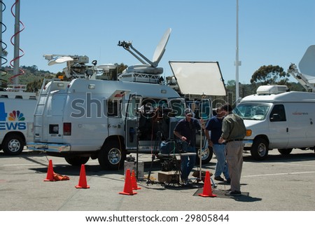 SANTA BARBARA, CA - MAY 06 : A news crew covering the Jesusita Fire unpacks its gear at the Earl Warren command post May 06, 2009 in Santa Barbara, CA.