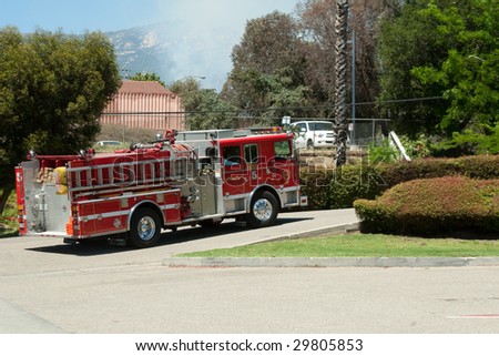 SANTA BARBARA, CA - MAY 06 : A firetruck leaves the Earl Warren command center on its way to fight the Jesusita Fire May 06, 2009 in Santa Barbara, CA.