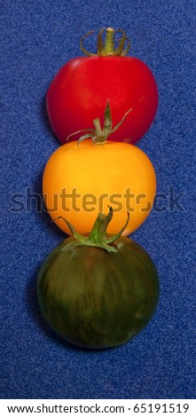 Ready, set, go tomatoes on a blue background.