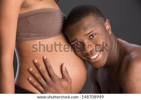 African American Couple Expecting Pregnancy Studio Portrait