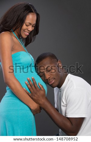 African American Couple Expecting Pregnancy Studio Portrait