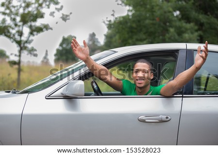 Joyful African American Male Driver Arms Out of Car Window