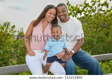 Happy African American Family Outdoor In Summer Sunny Day