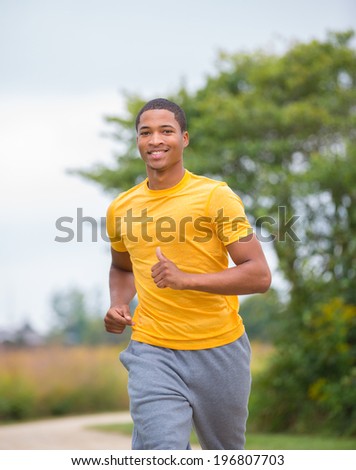 Young Healthy African American Jogging Outdoor Under Morning Sunlight
