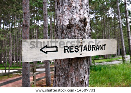 Restaurant Sign on a Pin Tree Deep inside Woods