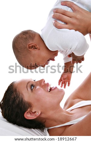 Happy Mother Holding Baby High Key Portrait