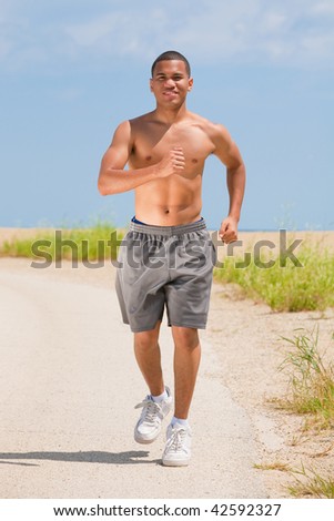 Healthy Natural Looking Young African American Male Runner under Summer Sunlight