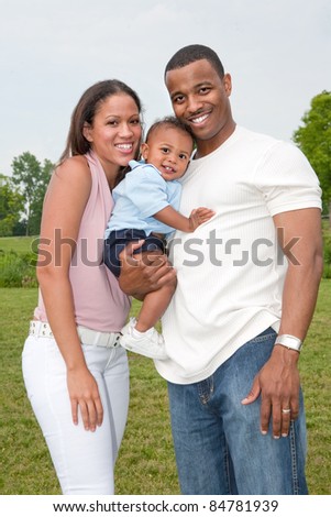 Happy African American Family Outdoor In Summer Sunny Day