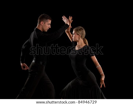 Ballroom Dancer Pair Dance Low Key on Black Background