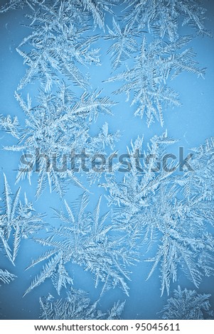 Natural Icicle frost crystals pattern on windows close-up macro photo