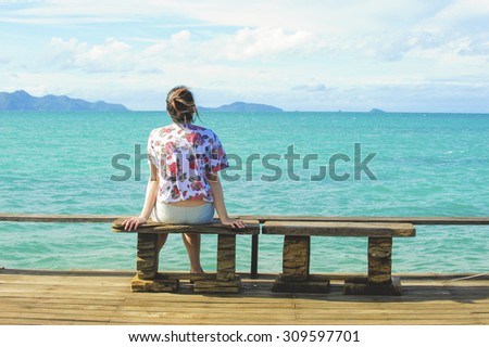 women sit on chair in Wooden pier on summer season - Wooden pier in Kho mak, Thailand