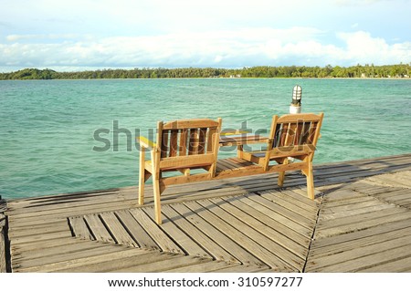 Chair on Wooden pier on summer season - Wooden pier in Kho mak, Thailand