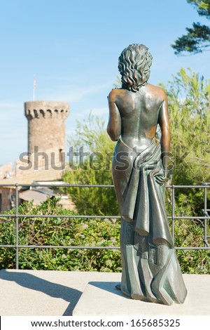 TOSSA DE MAR,SPAIN - OCTOBER 14: Bronze statue of Ava Gardner on october 14, 2012 in Tossa de Mar, Spain. Monument to the renowned American actress was opened within the Vila Vella in 1992