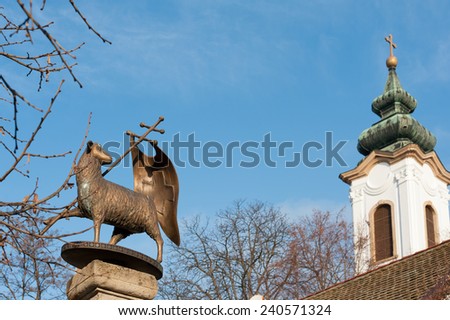 Lamb of God and belfry of Preobrazenska Orthodox Church. Szentendre, Hungary