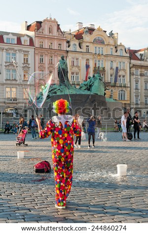 PRAGUE, CZECH REPUBLIC - MAY 19, 2014: Street artist makes soap bubbles at Old Town Square