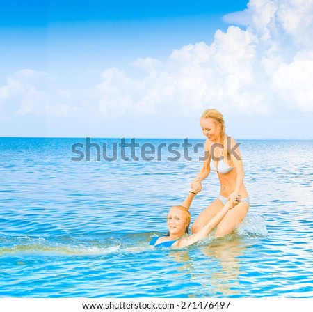 In Bikini In Water On a Beach