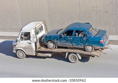 wreck car carrier truck deliver damaged car to repair box - See similar images of this \