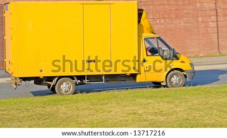 blank yellow big delivery truck on road