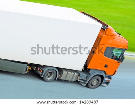 fast moving blank truck with blurred surrounding -  of \