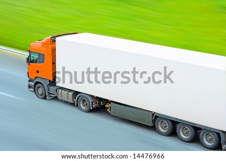 fast moving blank truck with blurred surrounding -  of 
