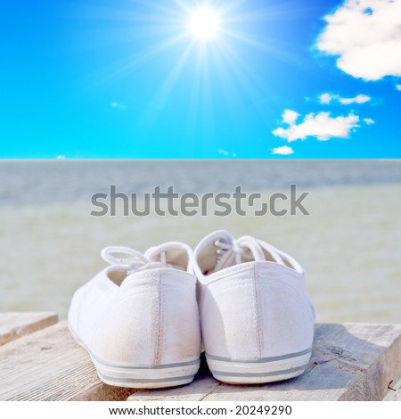white golf shoes on a wood deck